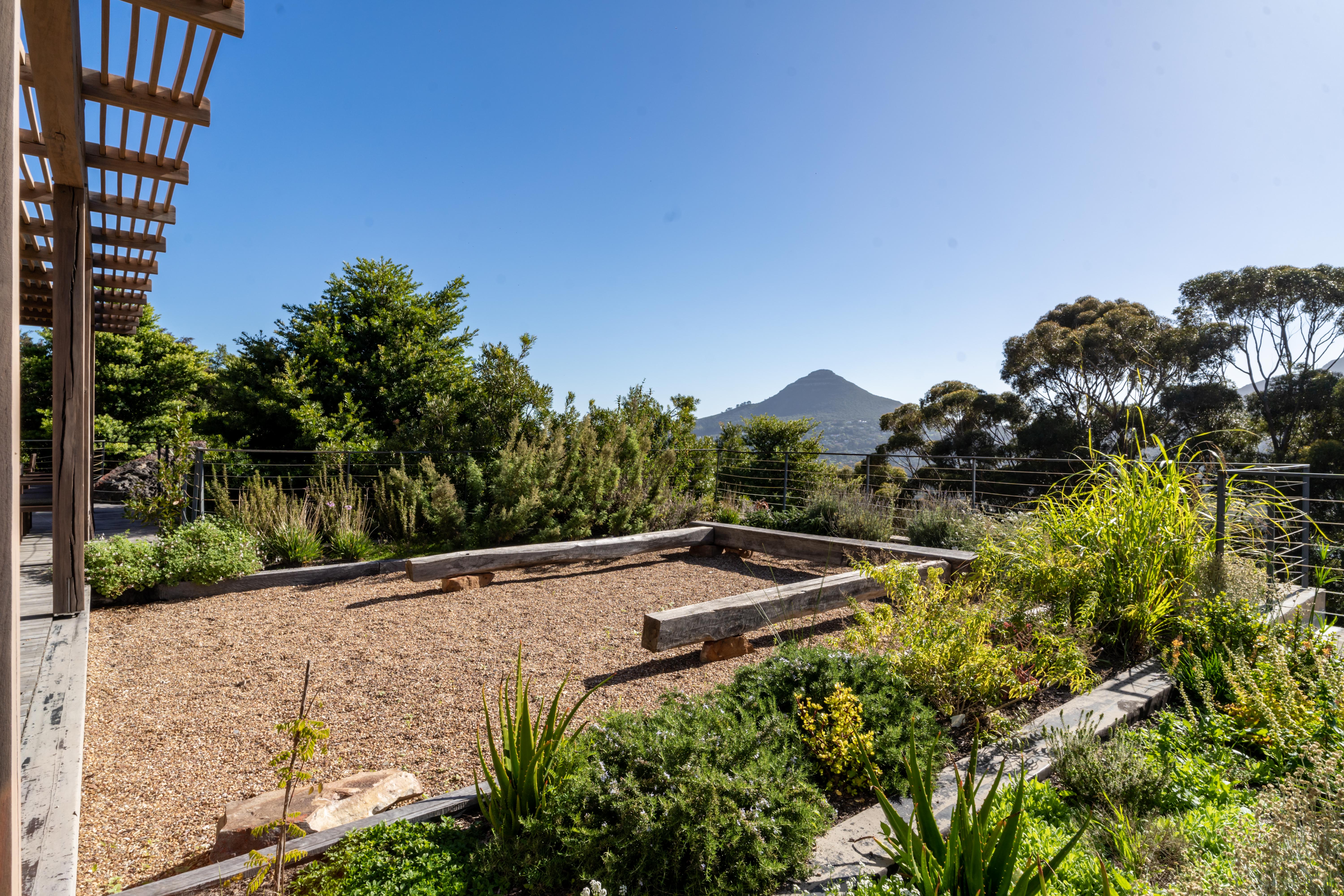 Raised vegetable beds in the kitchen garden, with the mountain behind